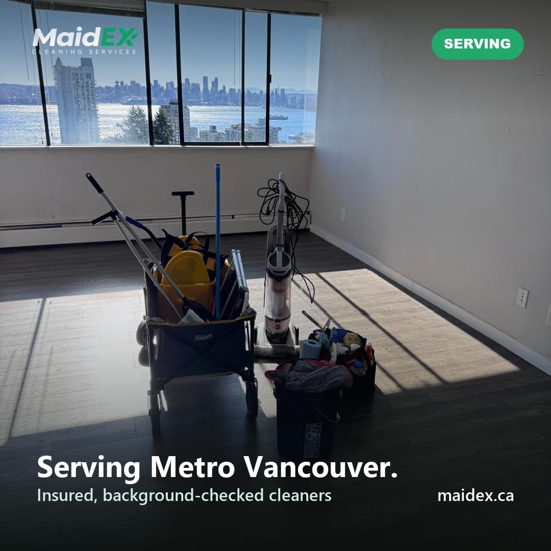 MaidEX cleaning cart and supplies in an empty apartment overlooking the Vancouver skyline