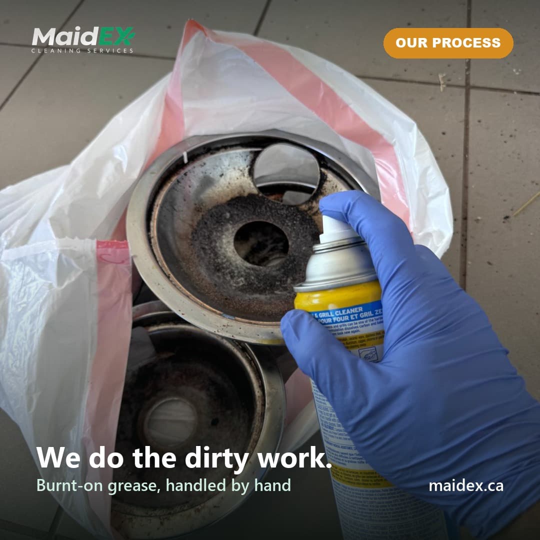 MaidEX cleaner spraying degreaser on burnt-on burner rings during a deep clean