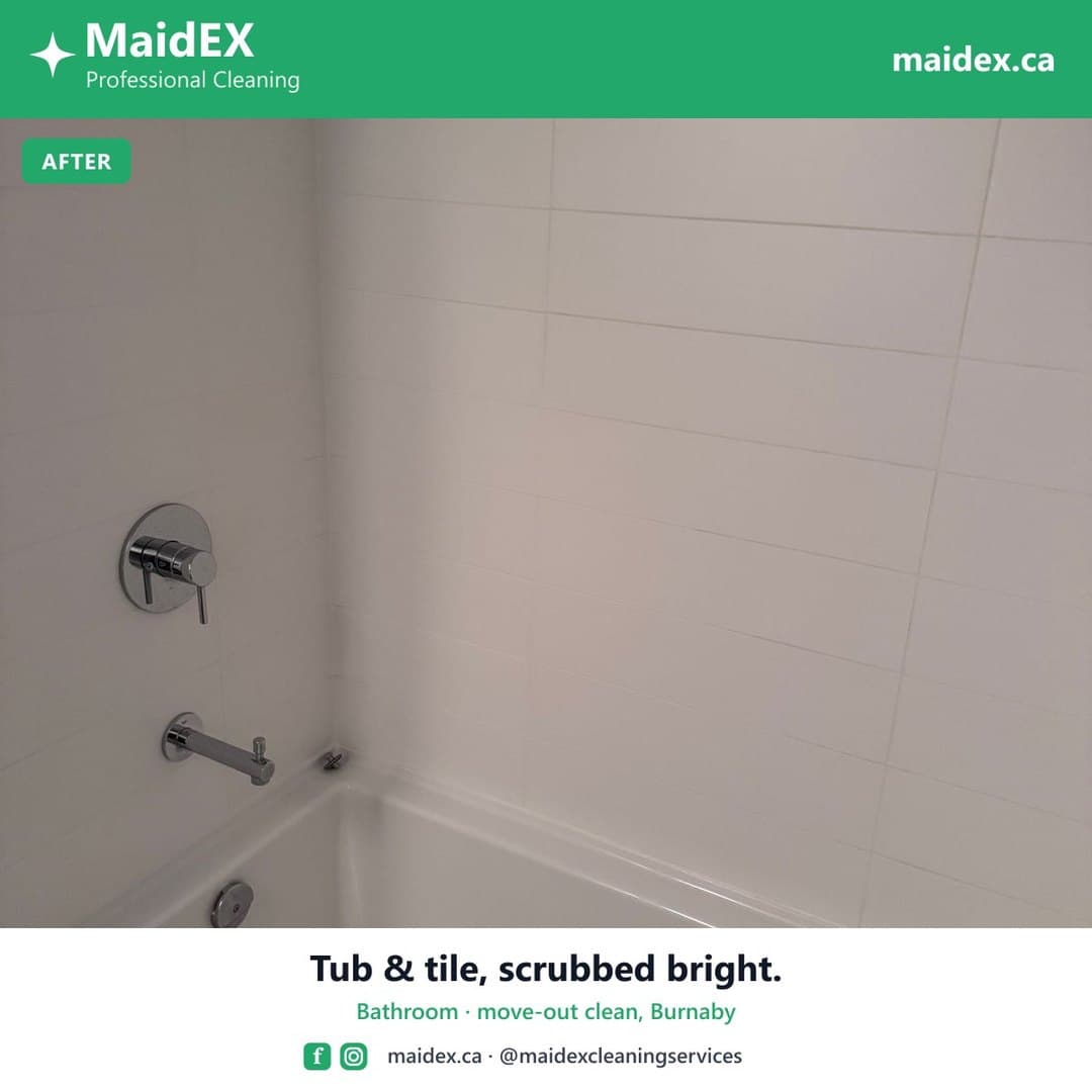 Bathtub and tile surround scrubbed clean after a MaidEX move-out clean in Burnaby